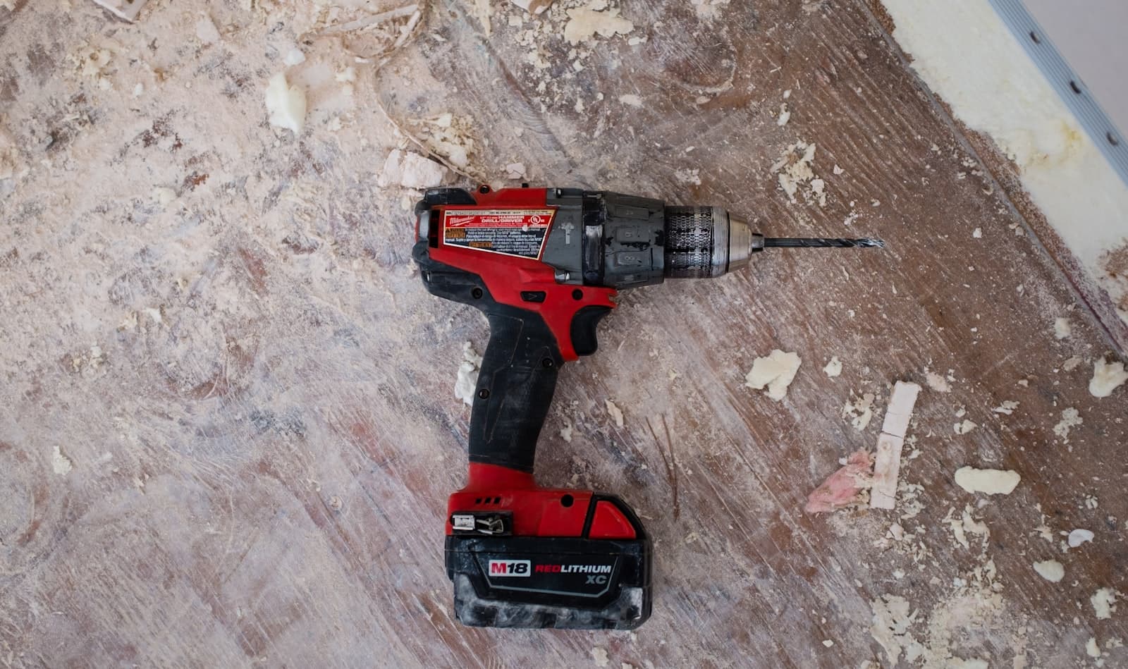 Cordless drill on a job-site work surface